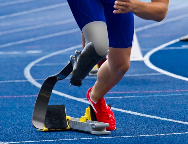 Handicapped sprinter on blue track